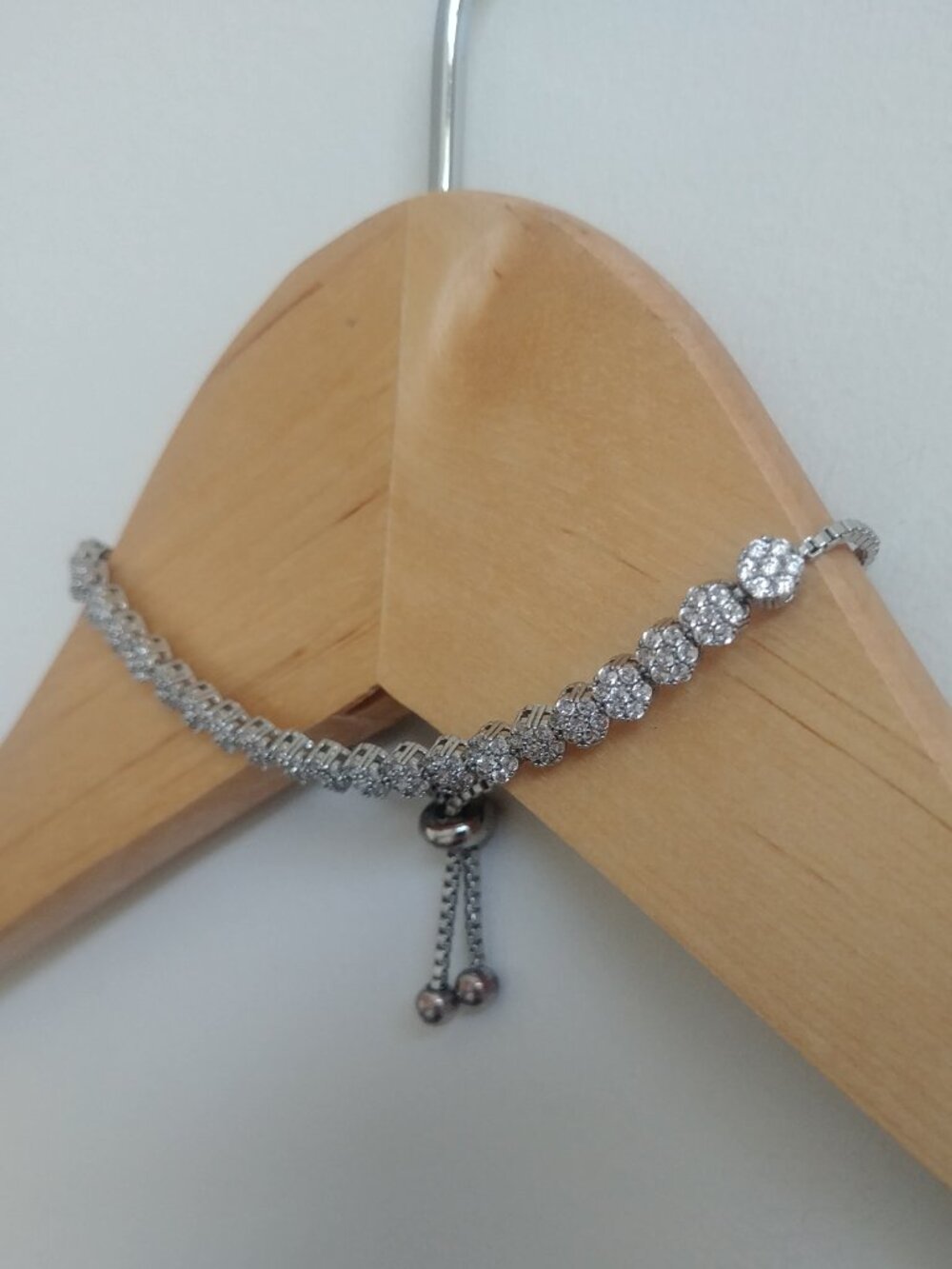 Dainty silver tone imitation diamond crystal flower chain drawstring clasp